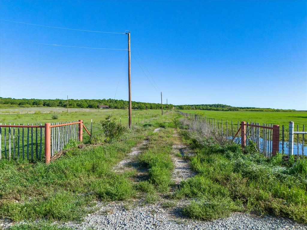 3760 Dewebber Road Bowie, TX 76230 - Photo 3 of 35 a view of a garden with a lake