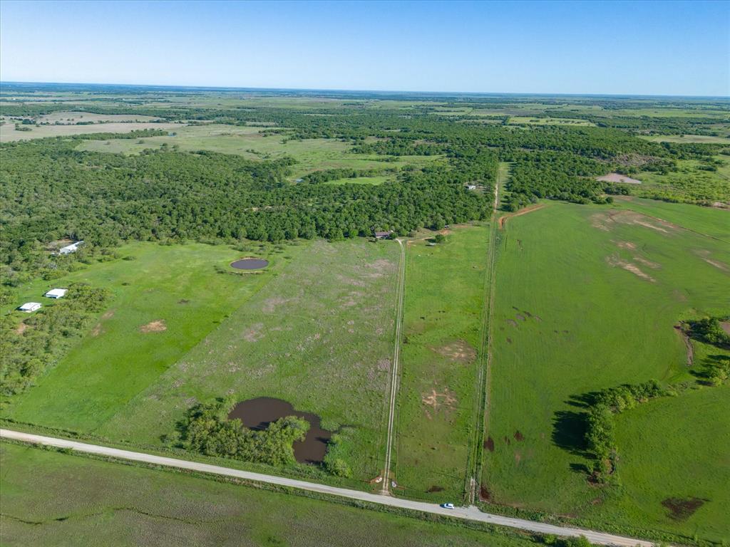3760 Dewebber Road Bowie, TX 76230 - Photo 32 of 35 a view of a garden from a yard