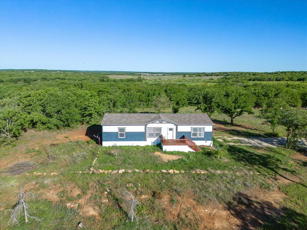 3760 Dewebber Road Bowie, TX 76230 - Photo 7 of 35 an aerial view of a house with a yard