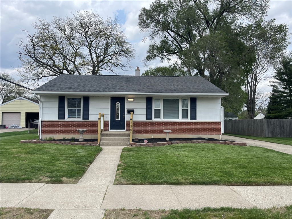 1361 Sussex Road Troy, OH 45373 - Photo 10 of 25 This charming residence features classic brick and siding, a welcoming entryway, and an expansive yard.