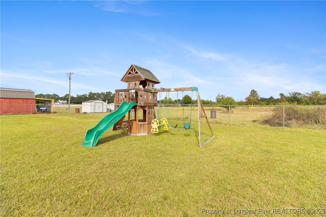 3376 Wade-Stedman Road Wade, NC 28395 - Photo 28 of 35 a view of a swimming pool with an ocean view