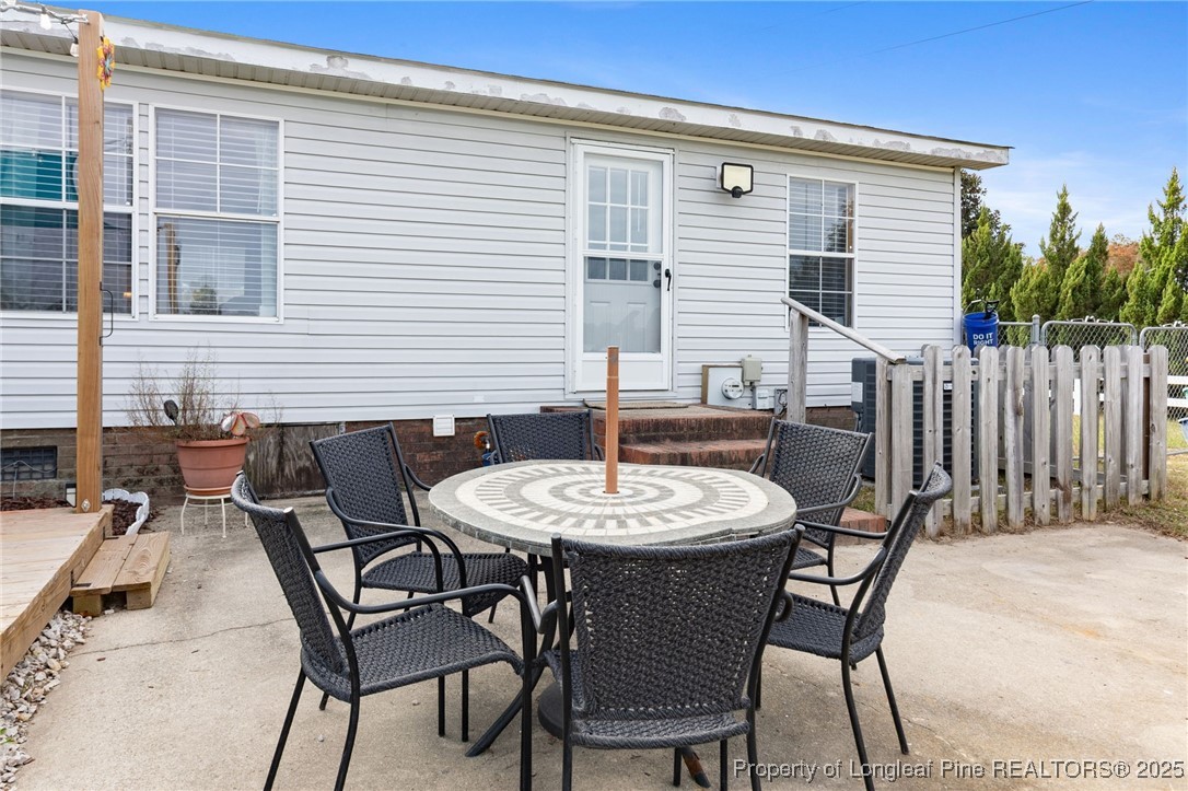 3376 Wade-Stedman Road Wade, NC 28395 - Photo 34 of 35 a balcony with table and chairs
