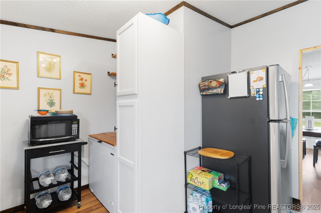 3376 Wade-Stedman Road Wade, NC 28395 - Photo 6 of 35 a bathroom with a refrigerator and a sink