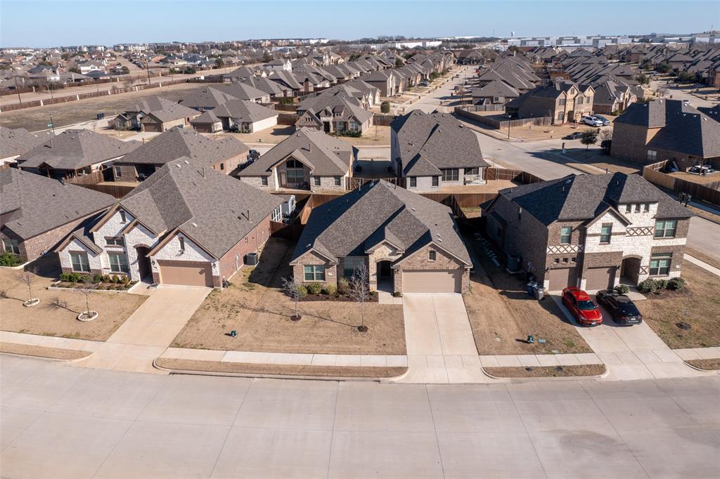 an aerial view of a house with a parking space