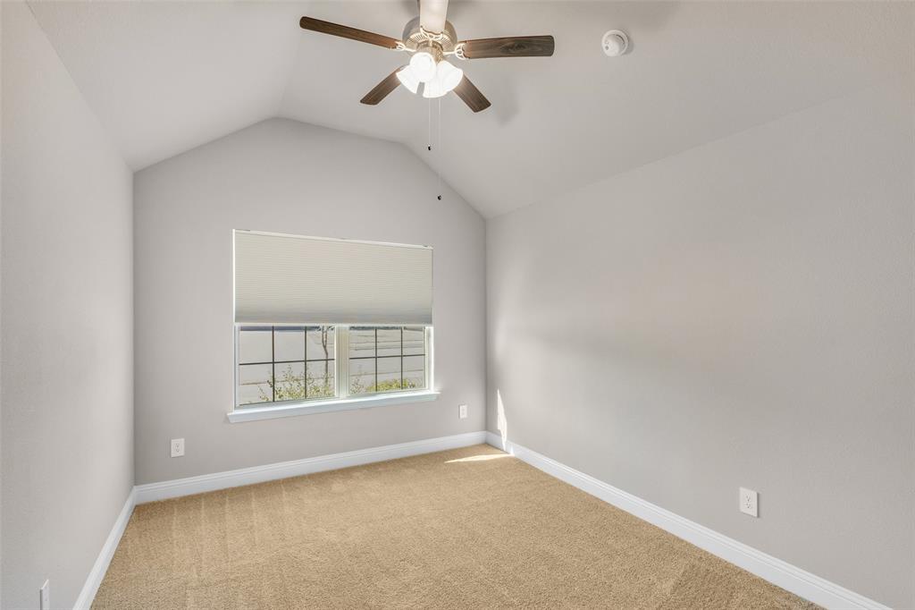 312 Eagle Ridge Road Forney, TX 75126 - Photo 15 of 39 an empty room with windows and fan
