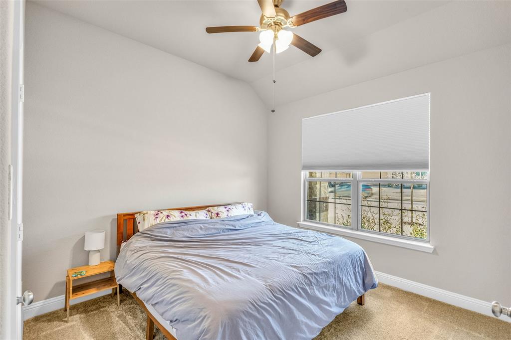 312 Eagle Ridge Road Forney, TX 75126 - Photo 5 of 39 a bedroom with a bed and a window