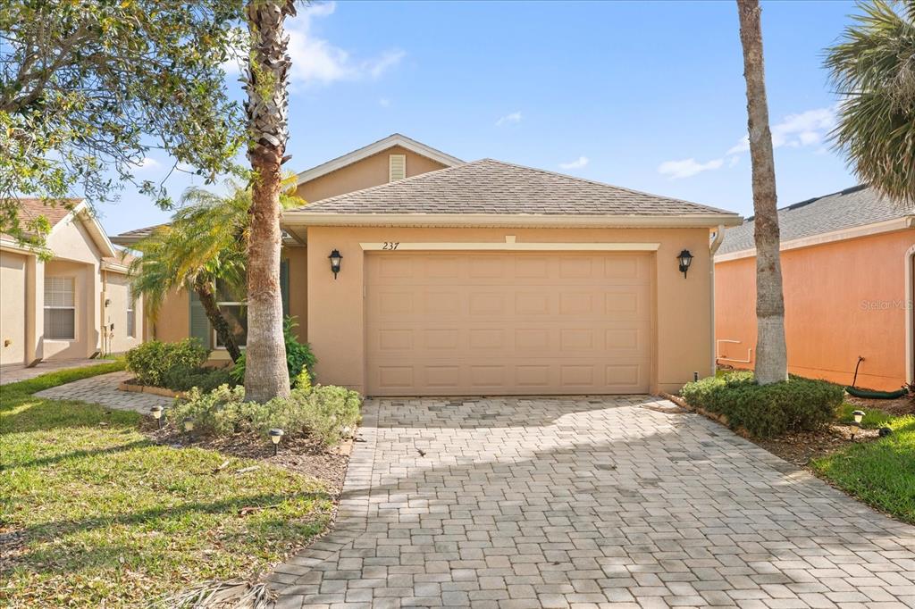 237 Rialto Road Kissimmee, FL 34759 - Photo 1 of 1 a front view of a house with a yard