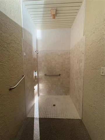 a view of a bathroom with a sink a toilet and a shower