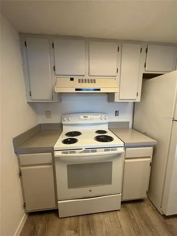 a view of washer and dryer with kitchen countertops