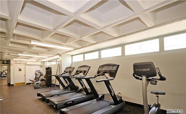 152-18 Union Turnpike, Unit 8F Queens, NY 11367 - Photo 9 of 10 a view of a room with gym equipment