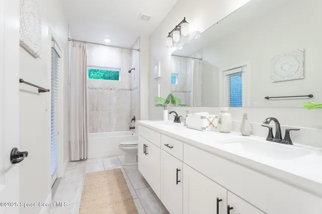 a view of a kitchen with sink and washing machine