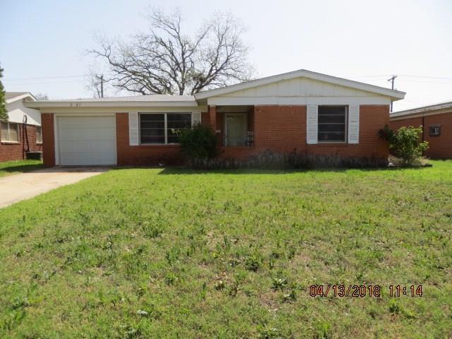 a front view of a house with yard and porch