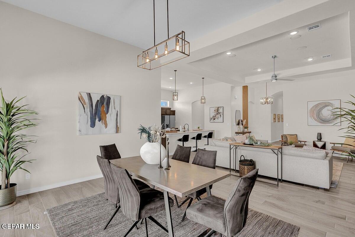 6923 Levee Circle Anthony, NM 88021 - Photo 13 of 44 a view of a dining room with furniture and wooden floor