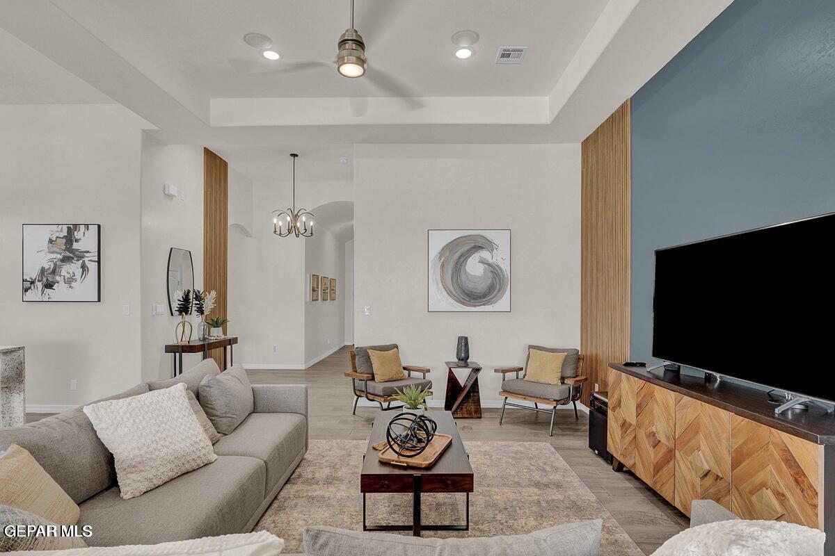 6923 Levee Circle Anthony, NM 88021 - Photo 15 of 44 a living room with furniture and a flat screen tv