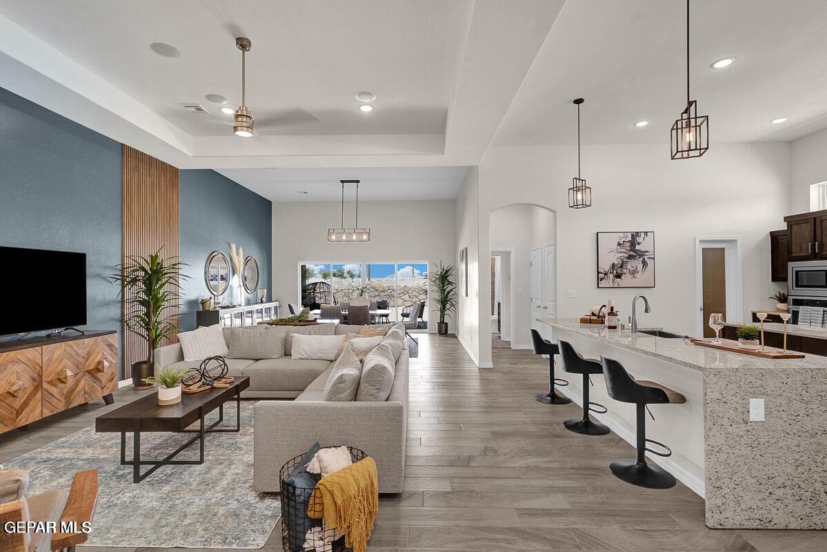 6923 Levee Circle Anthony, NM 88021 - Photo 20 of 44 a living room with furniture and a flat screen tv