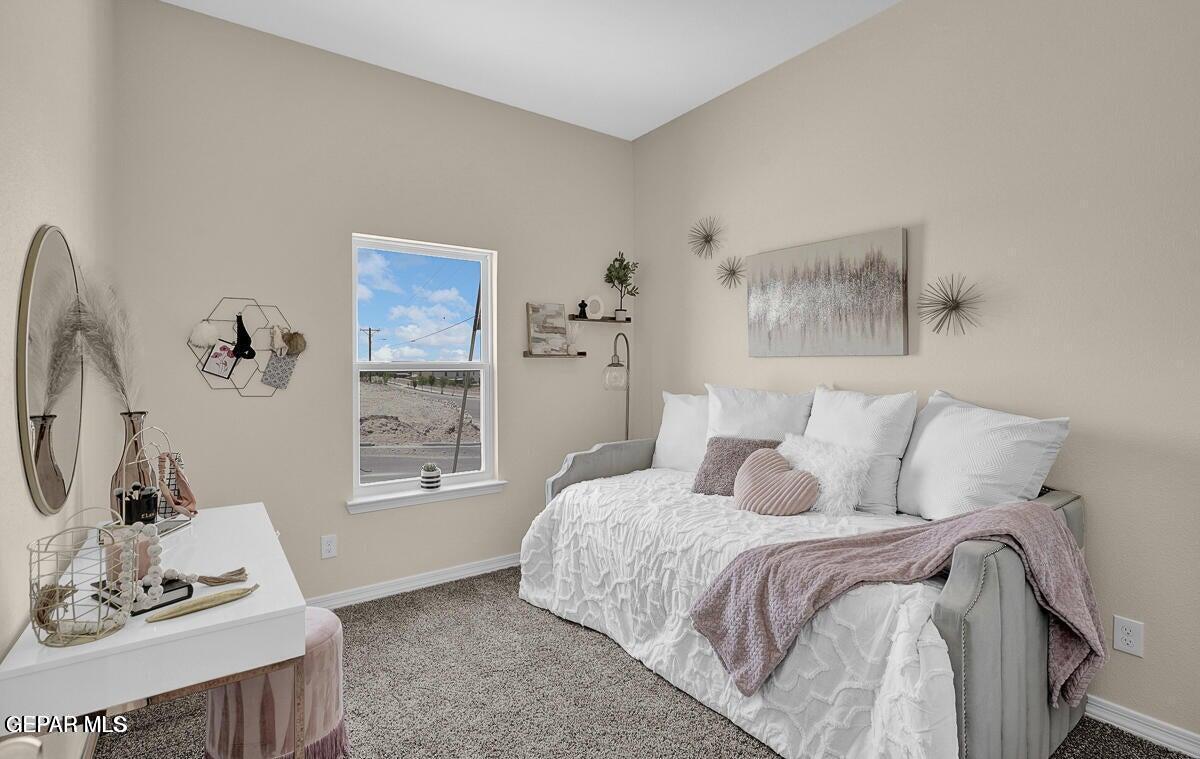6923 Levee Circle Anthony, NM 88021 - Photo 23 of 44 a bedroom with a bed and wooden floor