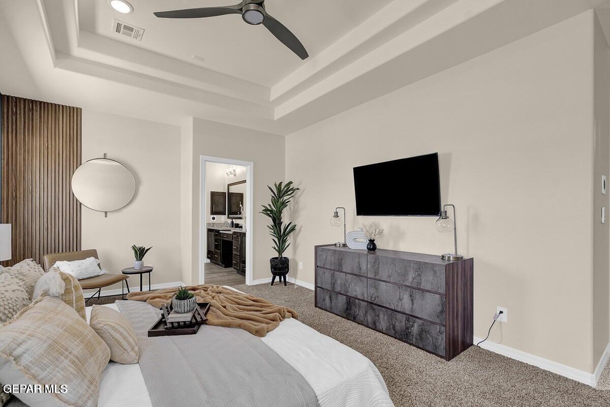 6923 Levee Circle Anthony, NM 88021 - Photo 37 of 44 a living room with furniture a flat screen tv and a chandelier