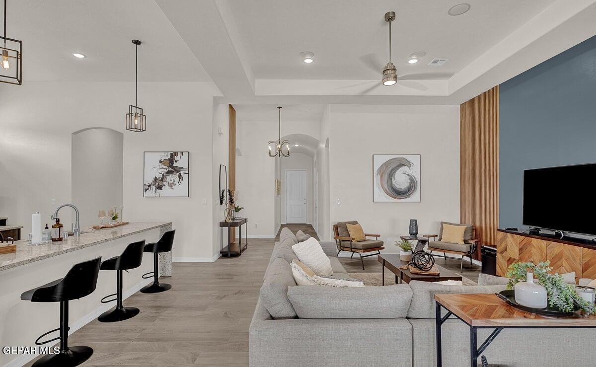6923 Levee Circle Anthony, NM 88021 - Photo 4 of 44 a living room with fireplace furniture and a flat screen tv