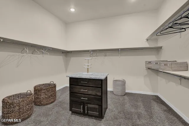 a view of a room with wooden floor and staircase