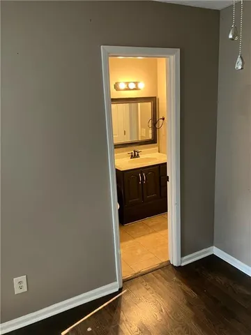 a view of a bathroom with a tub and sink