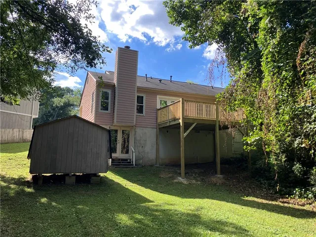 a house that has tree in front of it