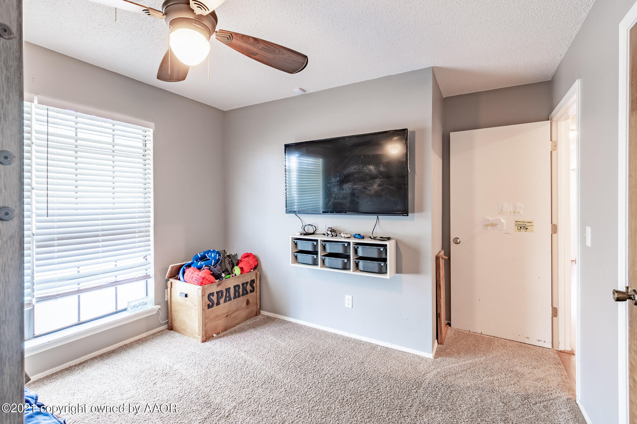 7306 Imperial Drive Amarillo, TX 79121 - Photo 15 of 24 a living room with furniture and a flat screen tv