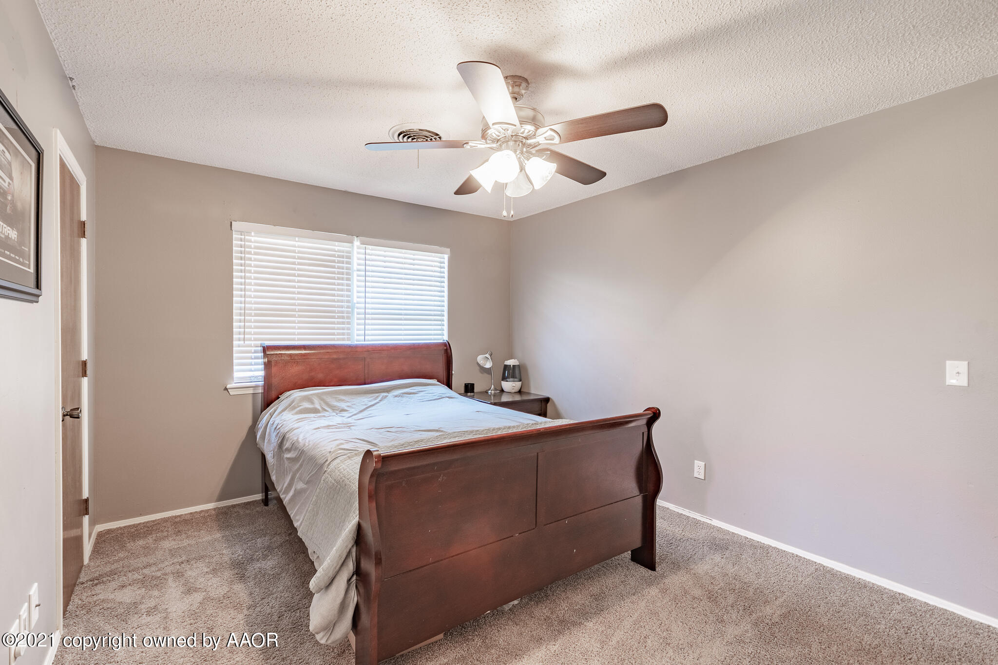 7306 Imperial Drive Amarillo, TX 79121 - Photo 17 of 24 a bedroom with a bed and window