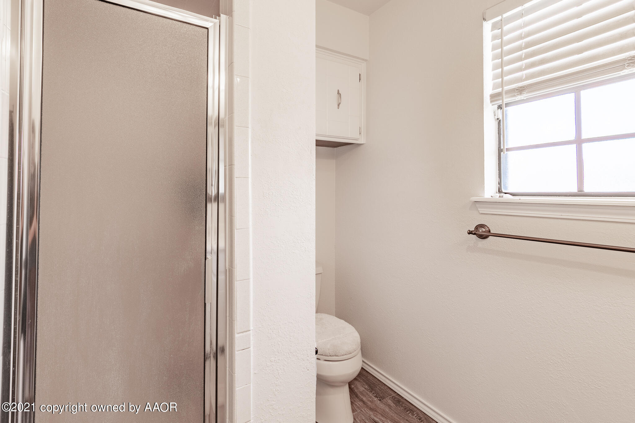 7306 Imperial Drive Amarillo, TX 79121 - Photo 19 of 24 a white toilet sitting next to a window