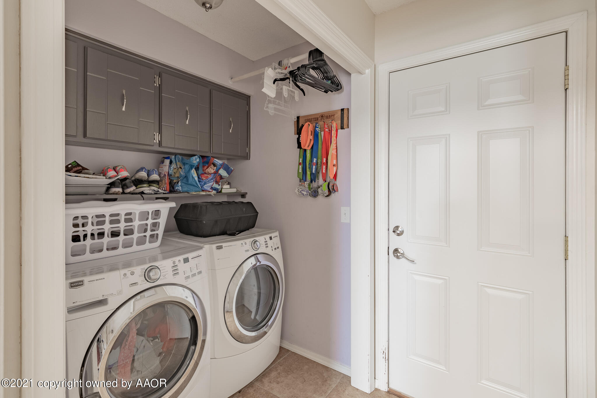 7306 Imperial Drive Amarillo, TX 79121 - Photo 8 of 24 a view of a storage and utility room with washer and dryer