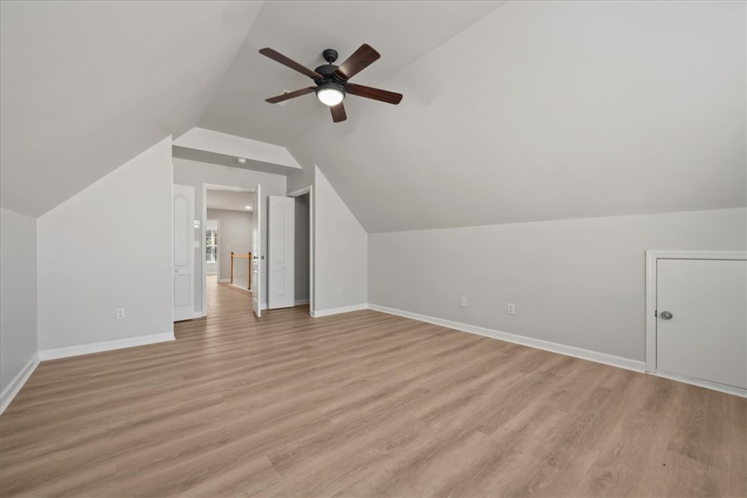 100 Shipyard Circle Anderson, SC 29621 - Photo 31 of 40 This airy room offers a spacious layout with sloped ceilings and durable flooring.