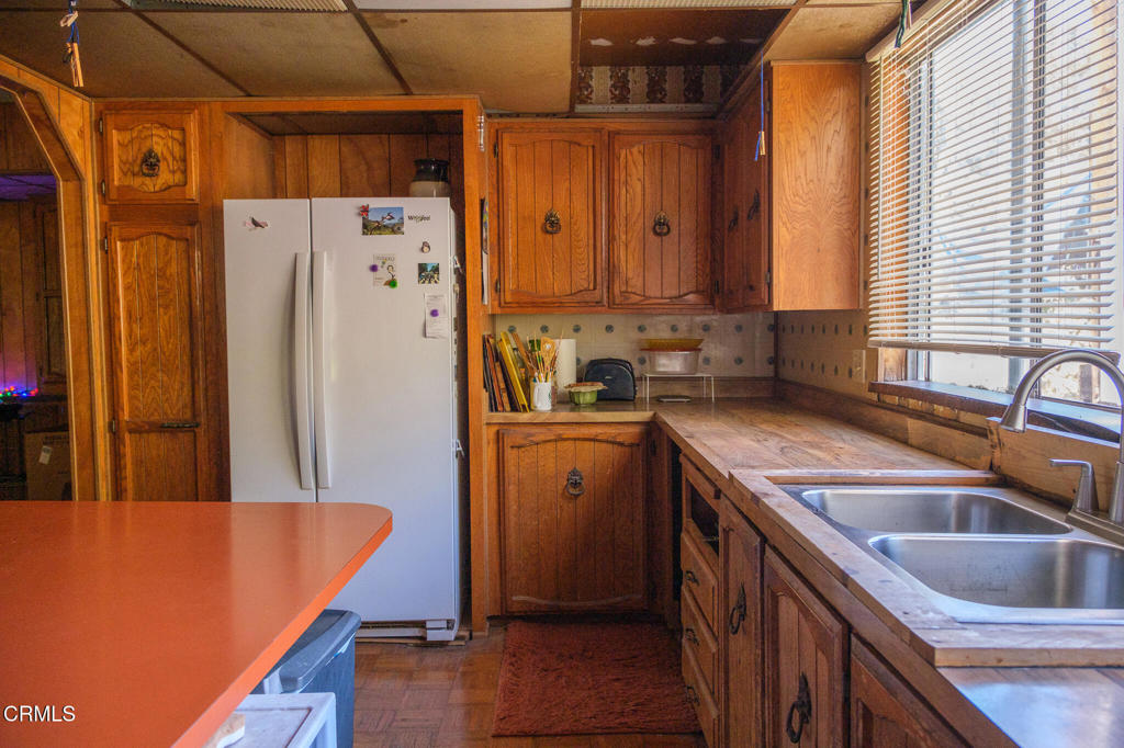 8624 Nye Road Ventura, CA 93001 - Photo 26 of 39 a kitchen that has a sink a refrigerator and a sink