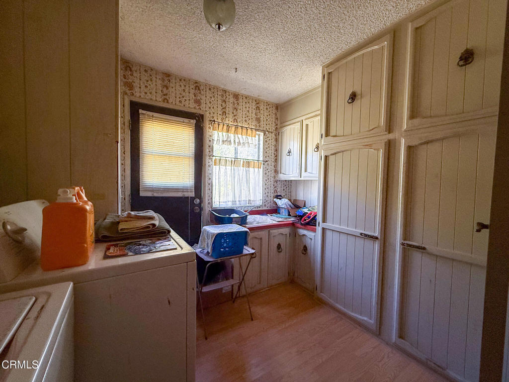 8624 Nye Road Ventura, CA 93001 - Photo 31 of 39 a room with storage and utility