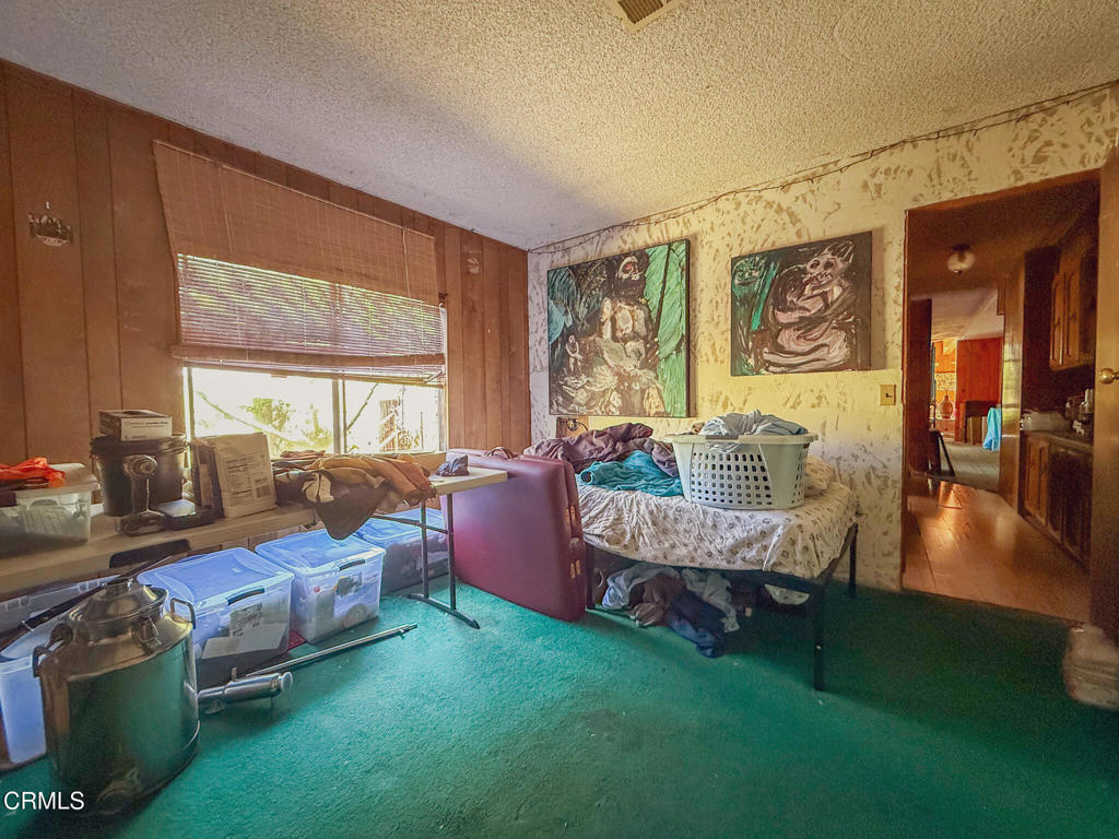 8624 Nye Road Ventura, CA 93001 - Photo 32 of 39 a living room with furniture and a large window
