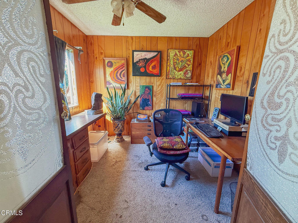 8624 Nye Road Ventura, CA 93001 - Photo 34 of 39 a living room with furniture a rug and a window