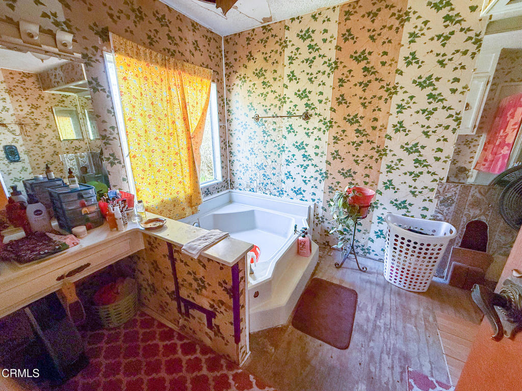 8624 Nye Road Ventura, CA 93001 - Photo 35 of 39 a bedroom with furniture and a window