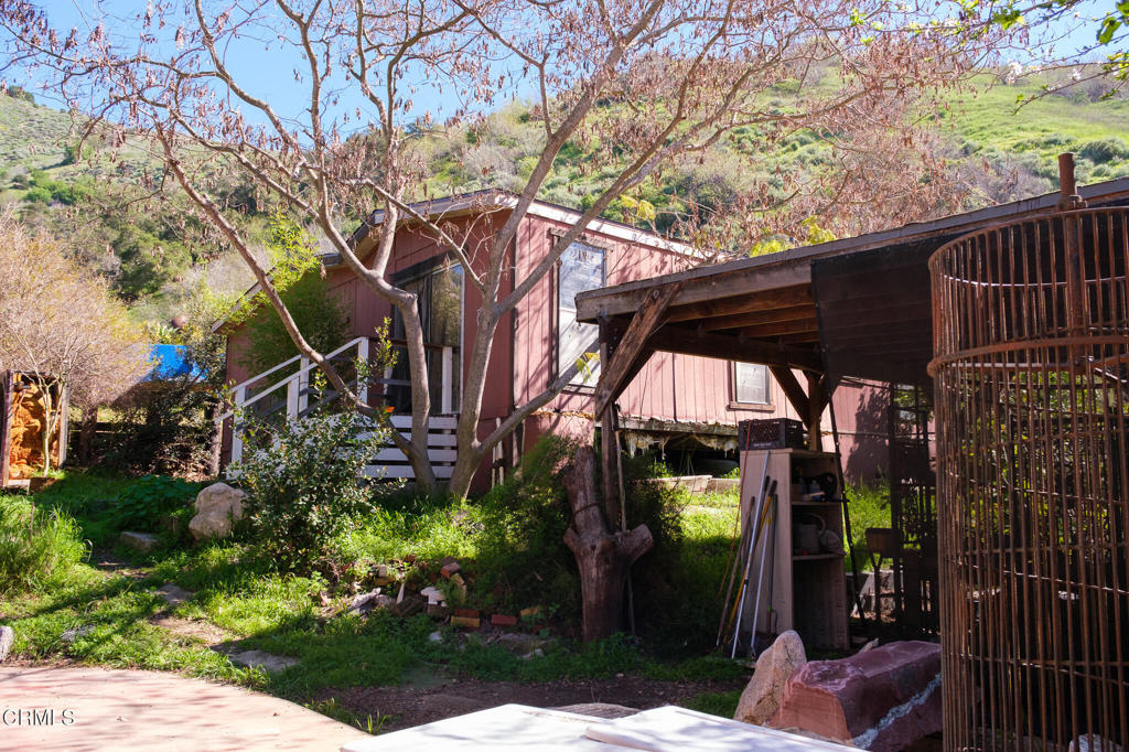 8624 Nye Road Ventura, CA 93001 - Photo 9 of 39 a view of a chairs and table in the patio next to a yard