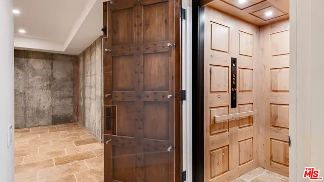 a bathroom with a shower and closet