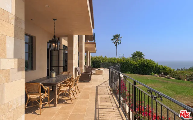 a view of a balcony with chairs