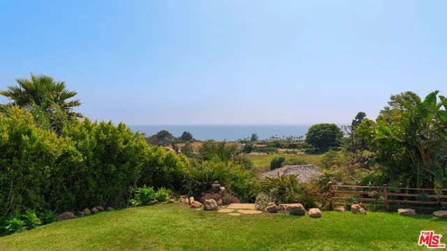 a view of a lake with houses in the back