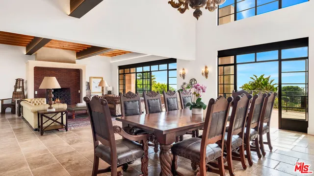a view of a dining room with furniture and window