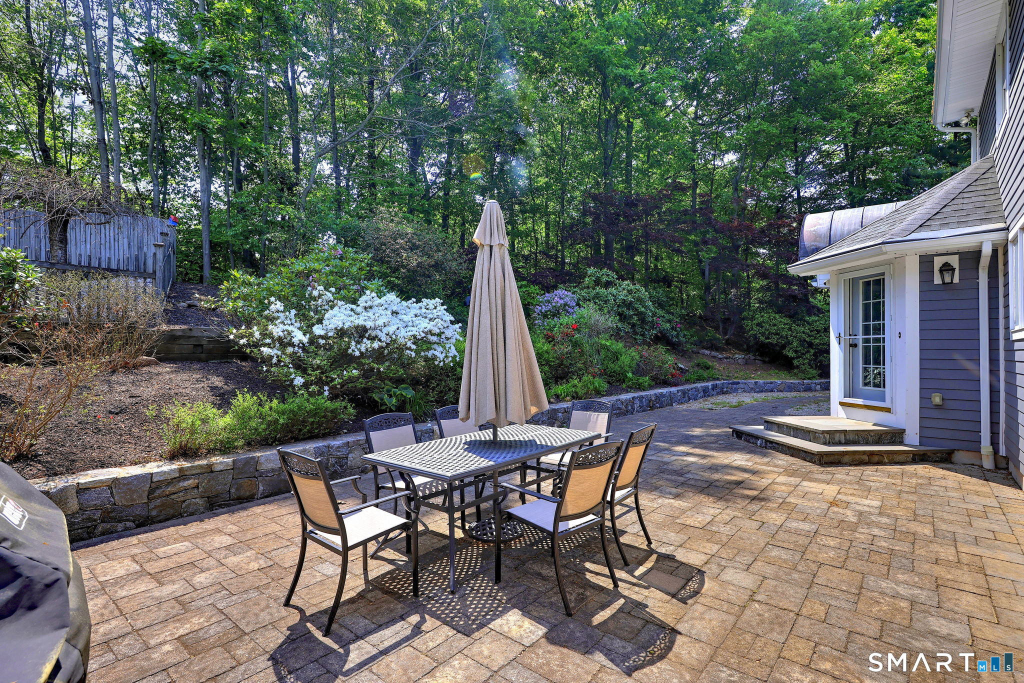 60 West Meadow Road Hamden, CT 06518 - Photo 10 of 35 Step outside to the patio, steps from the kitchen and the stairs leading up to the in pool.