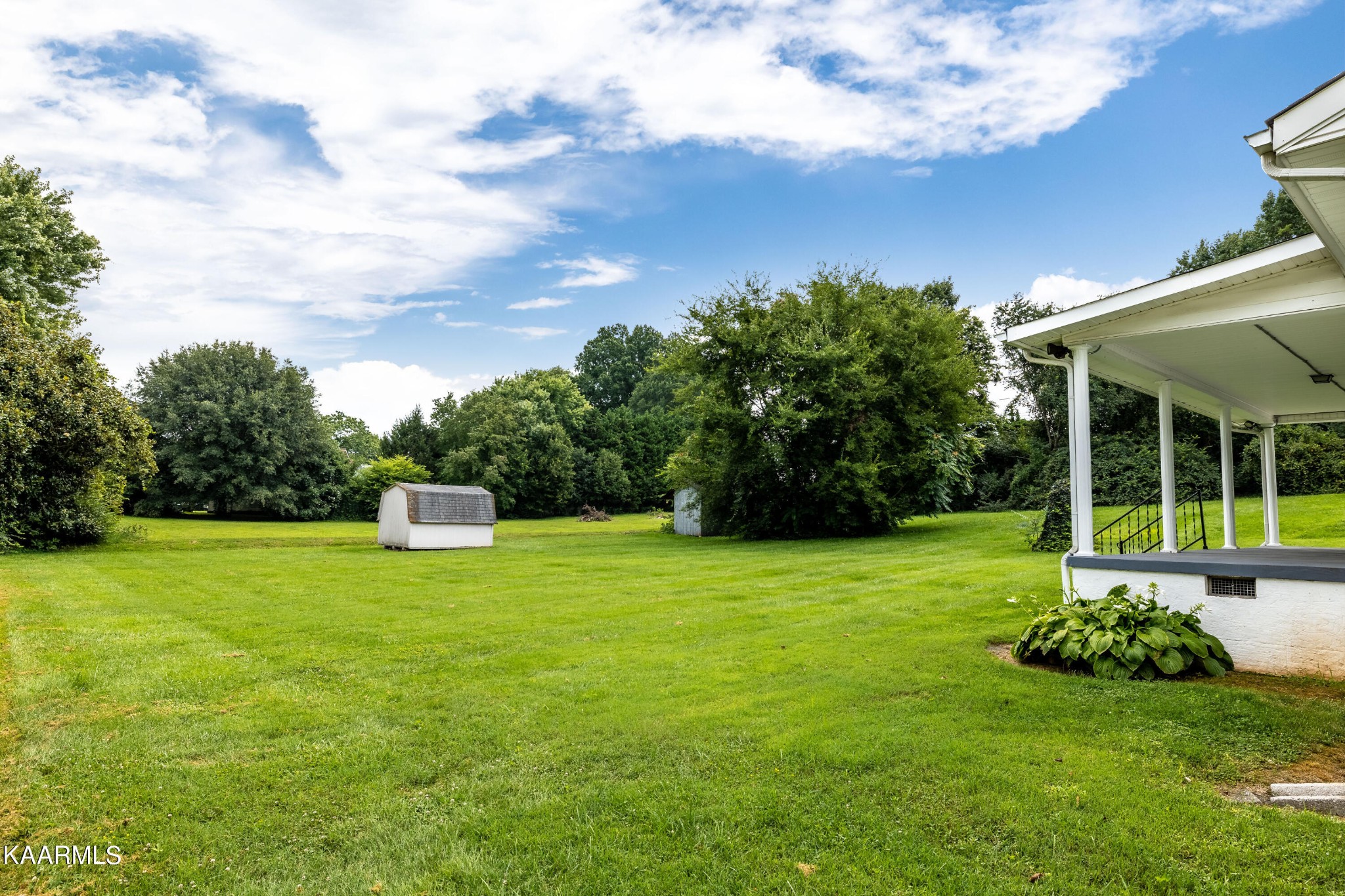7612 Gill Road Powell, TN 37849 - Photo 2 of 14 a view of a house with a backyard