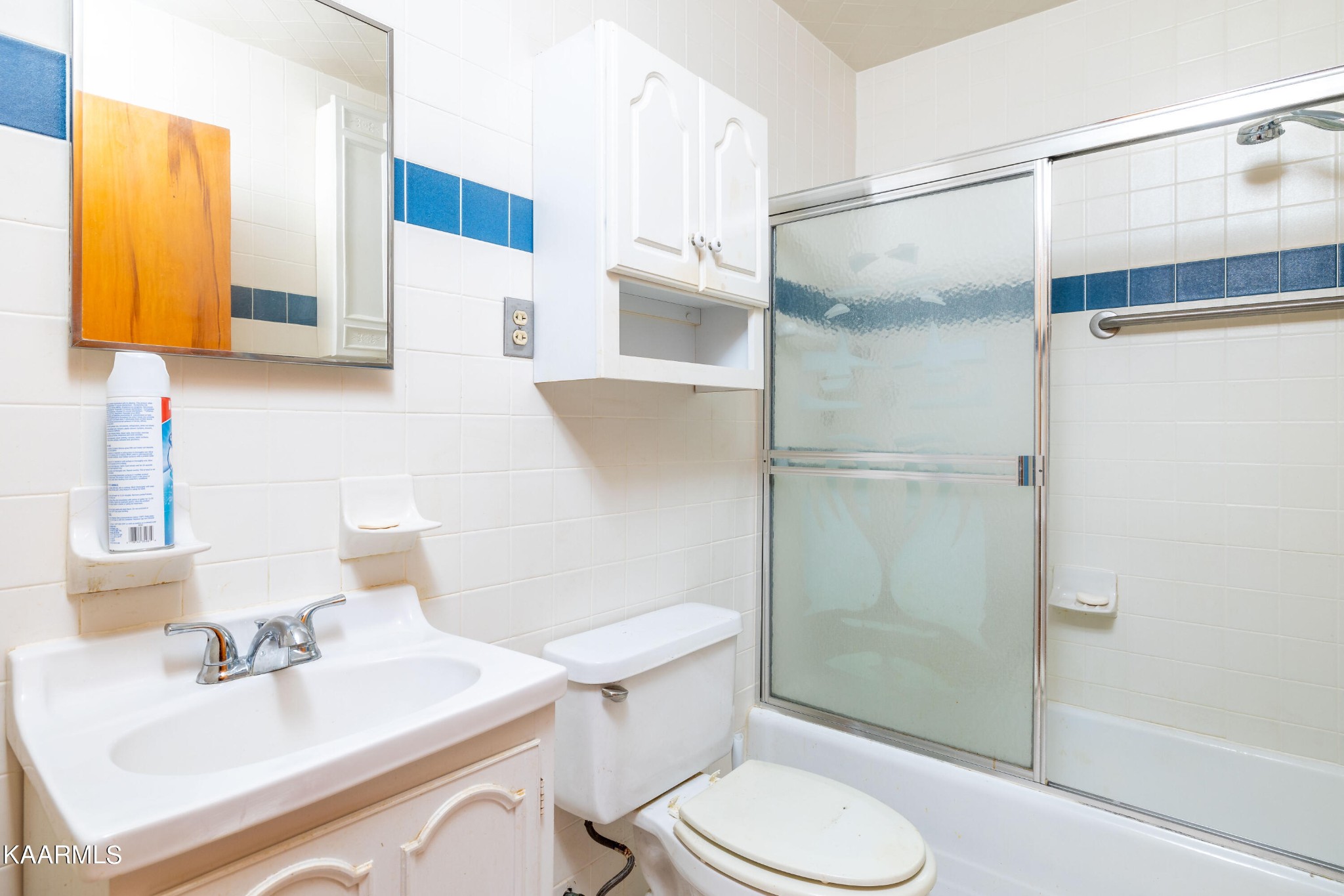 7612 Gill Road Powell, TN 37849 - Photo 9 of 14 a bathroom with a sink toilet and shower