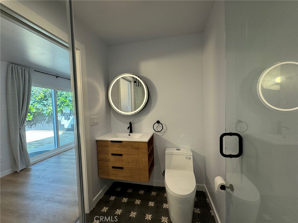 827 Delaware Road, Unit ADU Burbank, CA 91504 - Photo 13 of 20 a bathroom with a toilet a sink and mirror