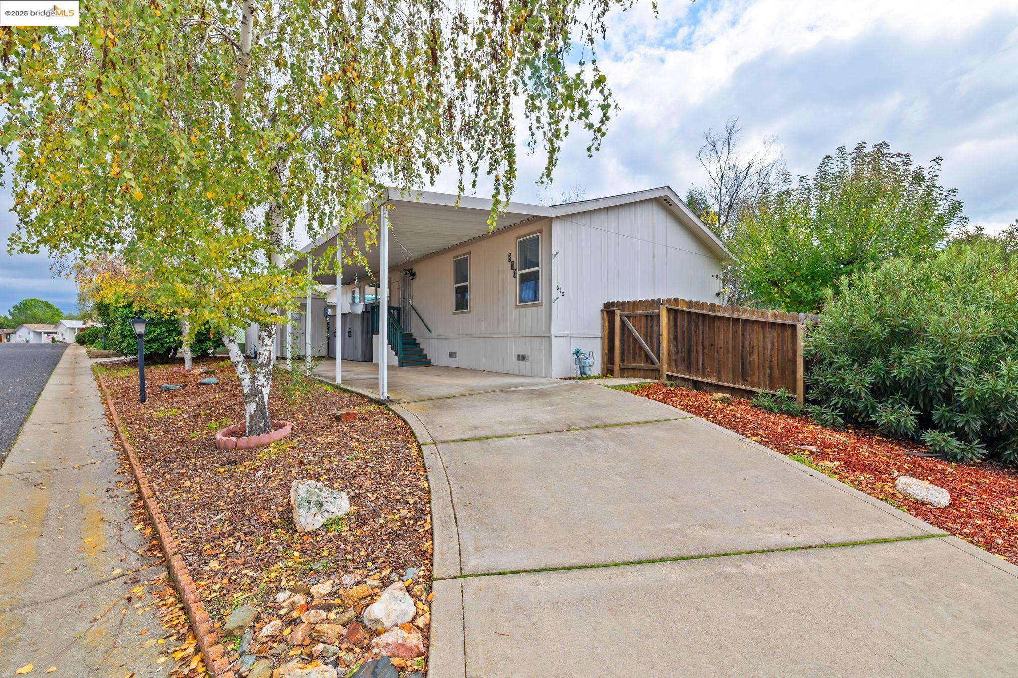 18717 Mill Villa Road, Unit 610 Jamestown, CA 95327 - Photo 1 of 35 front view of a house with a yard