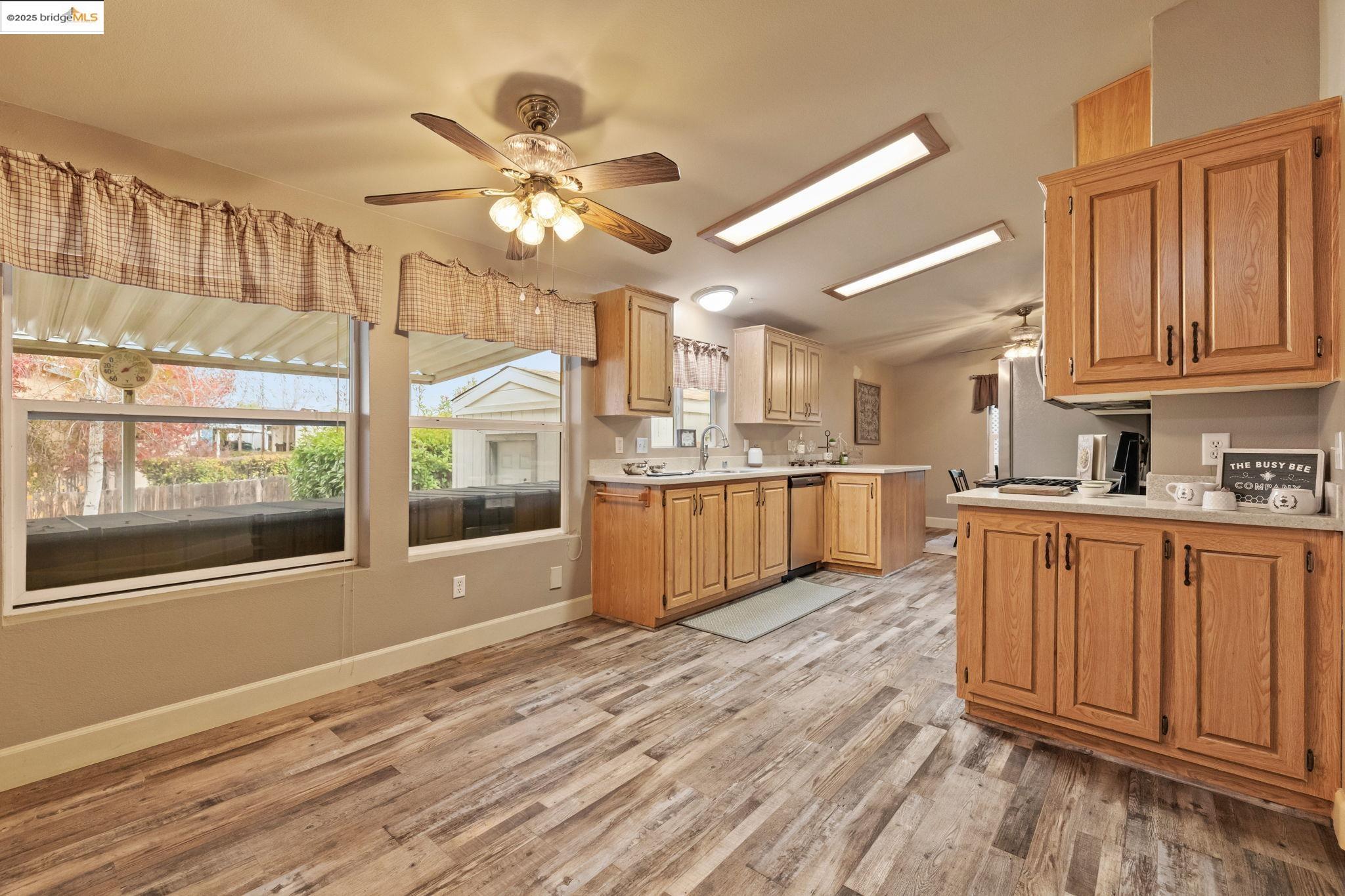 18717 Mill Villa Road, Unit 610 Jamestown, CA 95327 - Photo 11 of 35 a view of kitchen with wooden floor and window