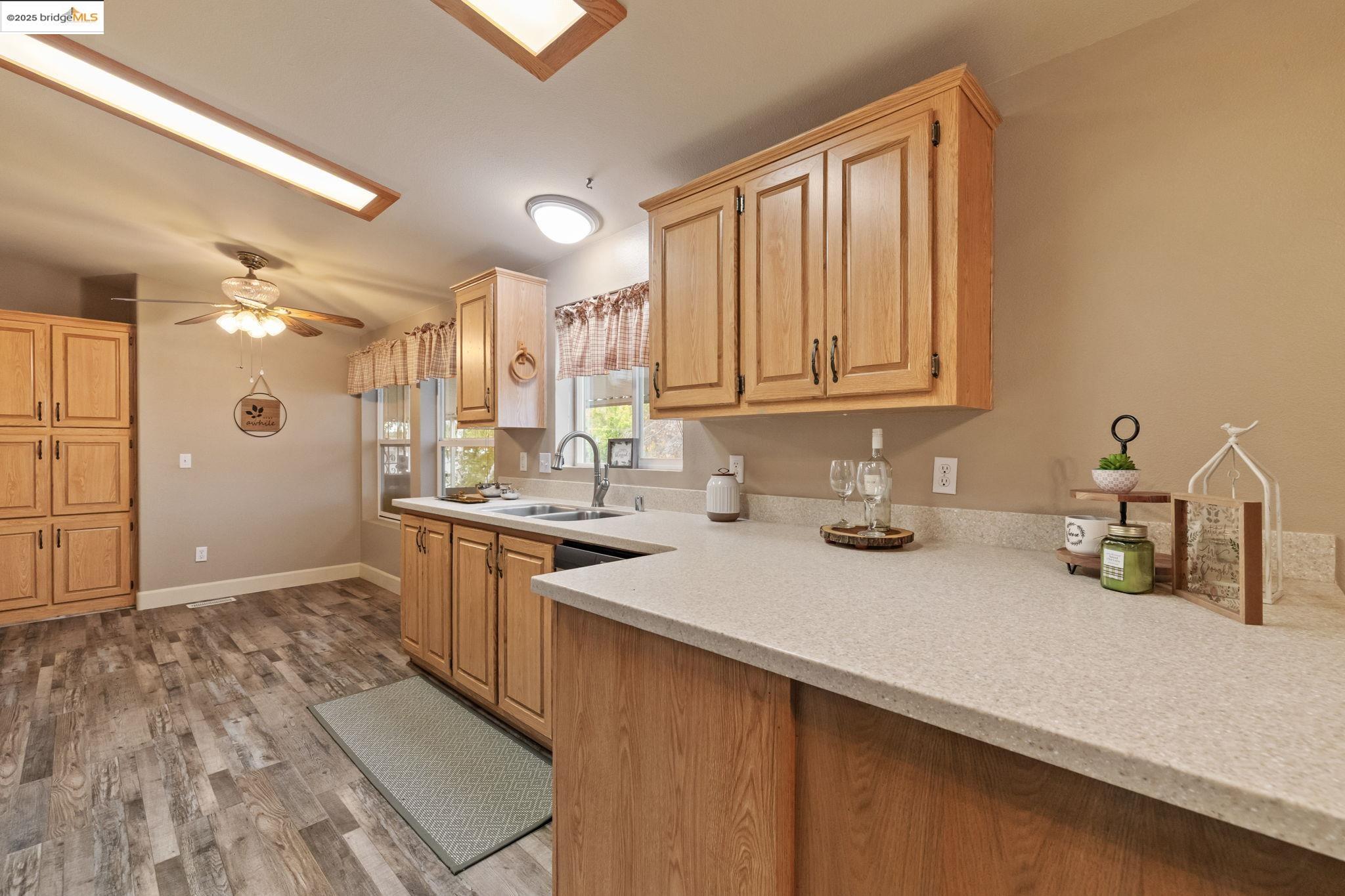 18717 Mill Villa Road, Unit 610 Jamestown, CA 95327 - Photo 13 of 35 a kitchen with stainless steel appliances granite countertop a sink stove and cabinets