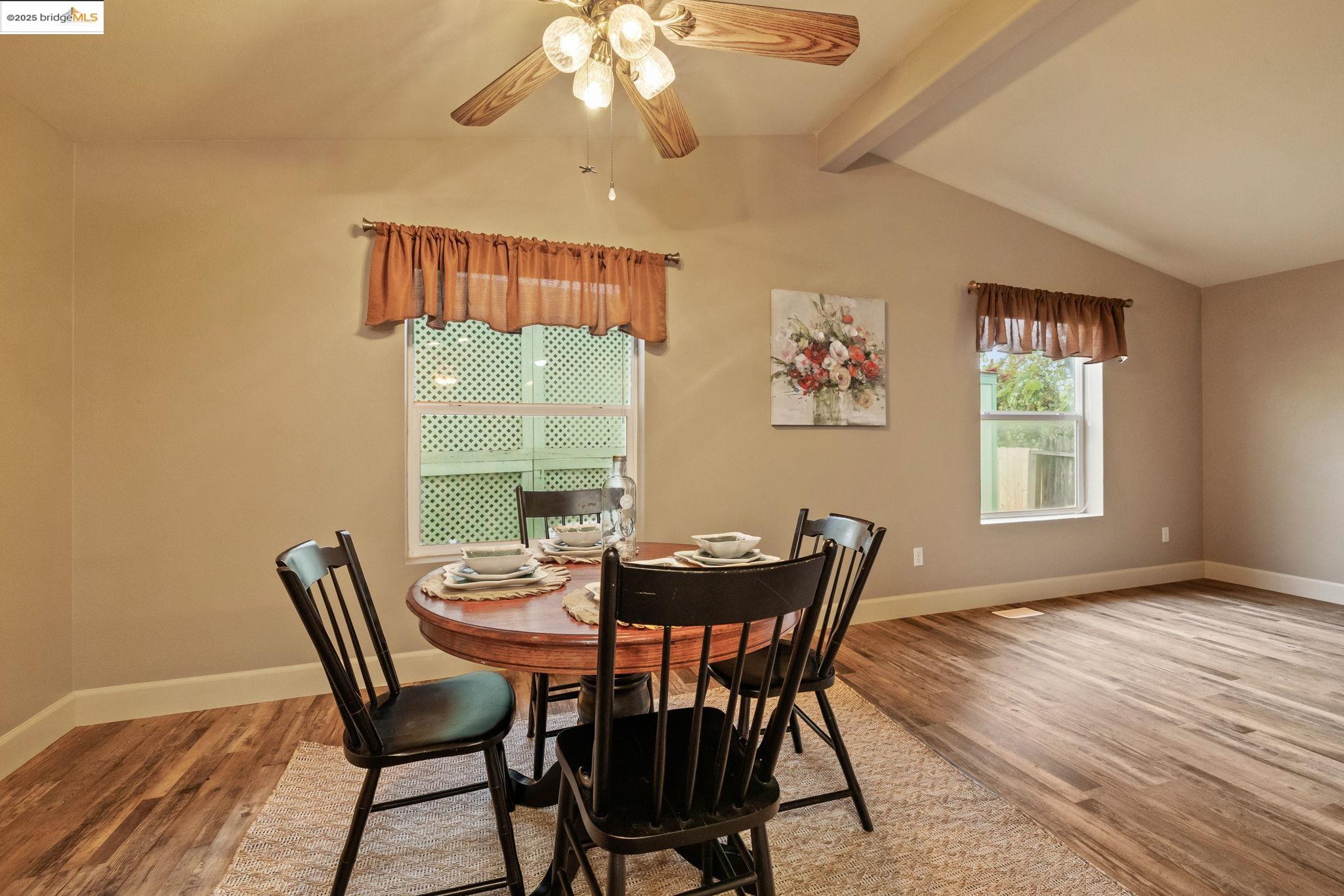 18717 Mill Villa Road, Unit 610 Jamestown, CA 95327 - Photo 6 of 35 a view of a dining room with furniture wooden floor and chandelier