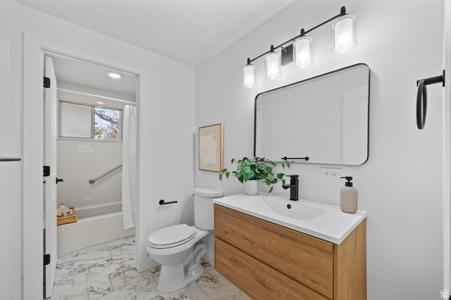 2267 West 4350th Street South Roy, UT 84067 - Photo 18 of 32 Full bath featuring vanity, shower / bathtub combination with curtain, and light marble finish flooring