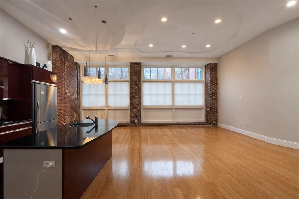 30 Market Street, Unit 7 Lowell, MA 01852 - Photo 3 of 11 a view of kitchen and windows